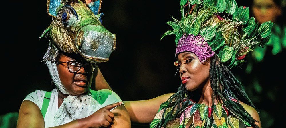 Two costumed performers on stage